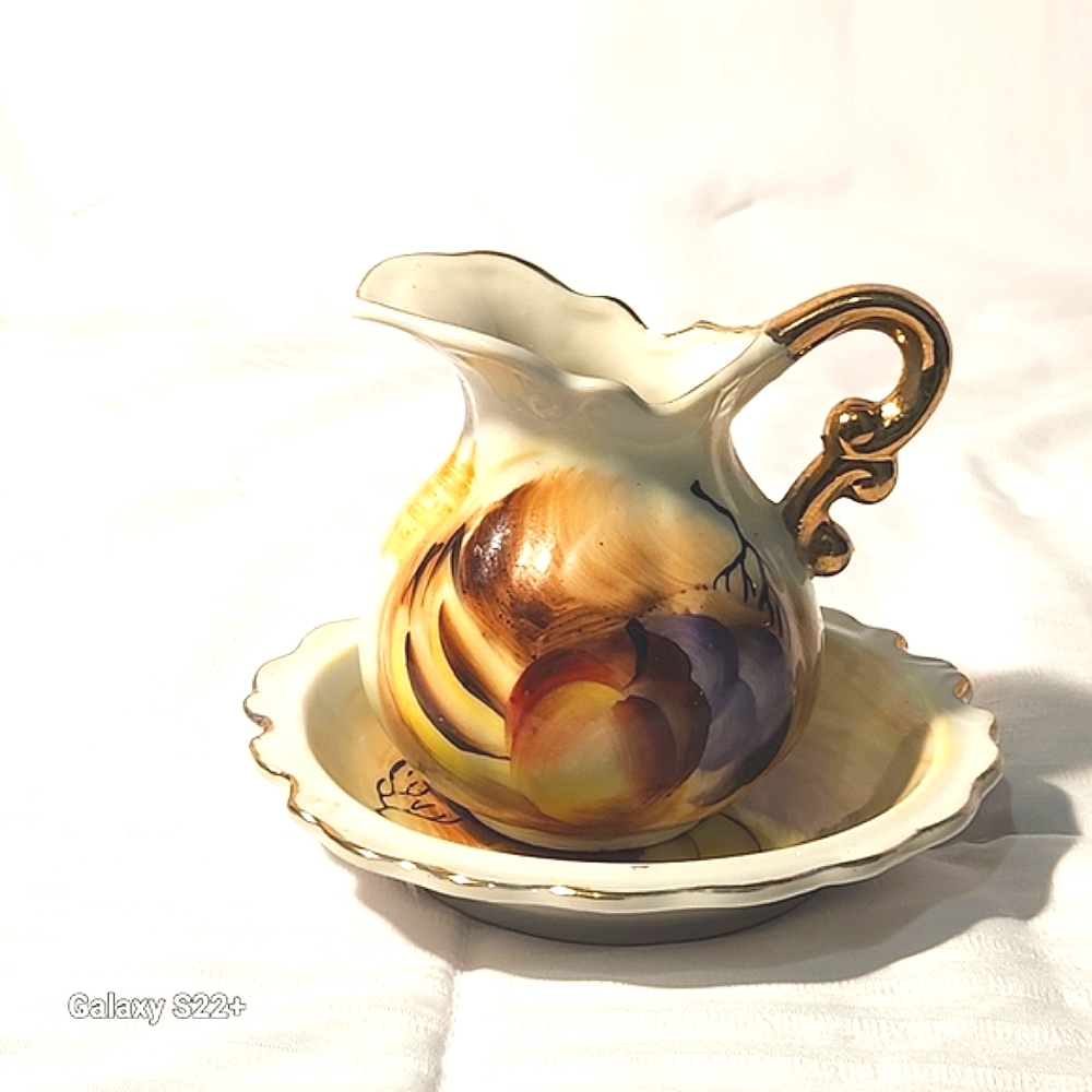 VINTAGE MINATURE PITCHER AND SAUCER SET